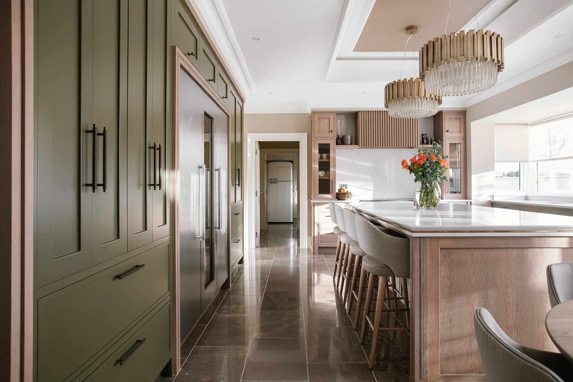 Custom in-frame cabinets with brass knurled handles in bespoke kitchen Doran Kitchens