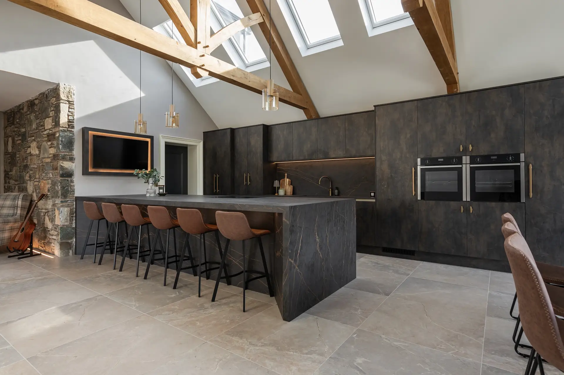 Stone Wall Entrance with Laurent Dekton Kitchen and Vaulted Ceiling Doran Kitchens